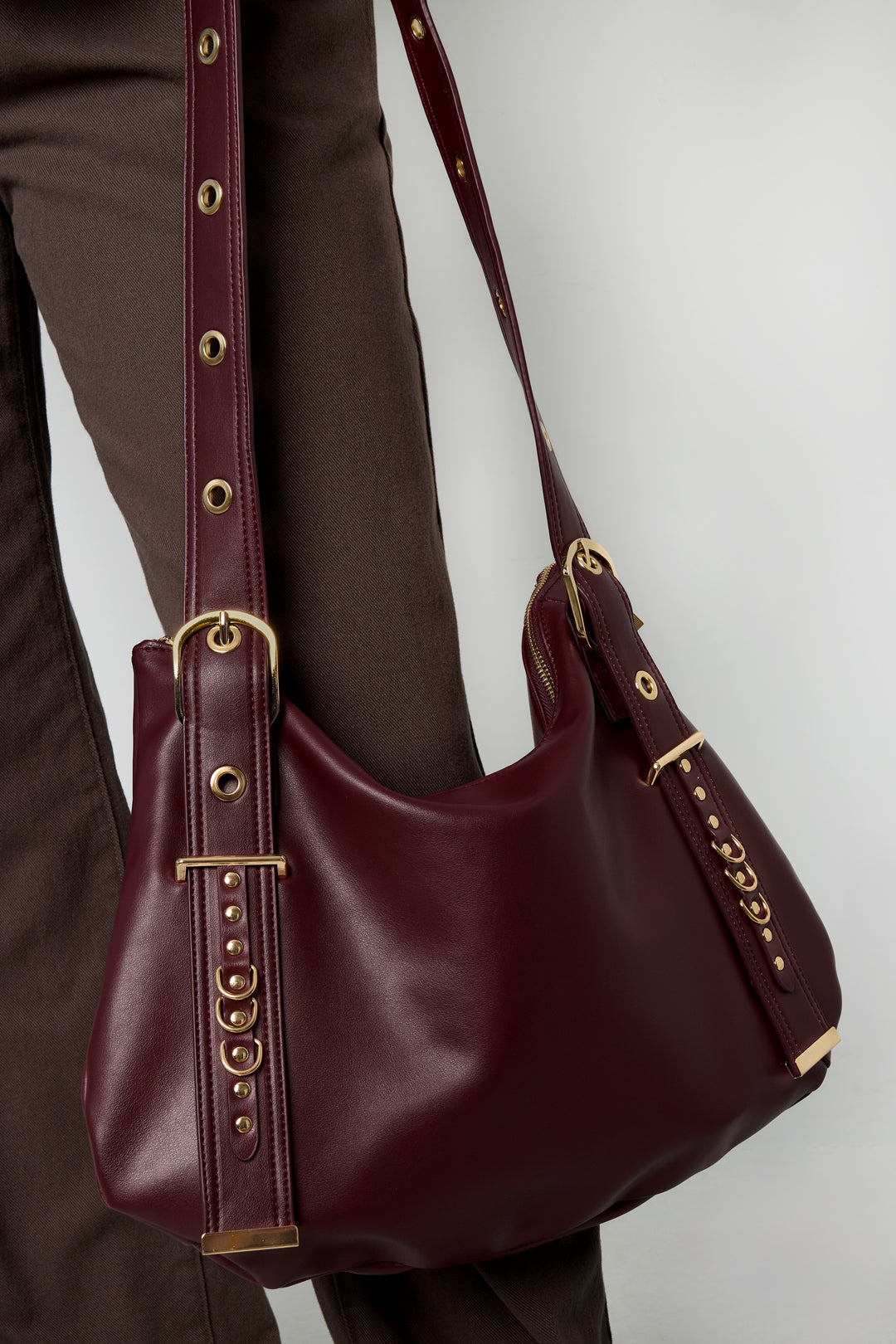 Leather shoulder bag by Amour Bijoux, burgundy with gold-tone hardware